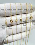 A close-up of a white fabric-covered hand displaying several gold-tone chain necklace clasp options labeled by width and clasp type, with text overlays reading 0.7mm, 0.8mm, 1mm, 1.2mm and 4mm spring clasp or 5mm spring clasp