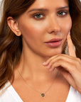 14K solid gold paw print necklace with cut-out disc pendant on twisted rope chain