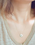 14k solid gold nautical compass necklace on a woman's neckyellow gold compass pendant