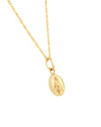 A solid gold rope chain necklace with an oval Virgin Mary La Milagrosa pendant, shown against a plain white background.