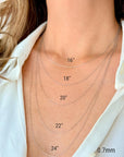 The woman's neck is adorned with five 14k white gold rope chains, each measuring 0.7 mm in thickness and available in 16", 18", 20", 22", and 24" lengths.