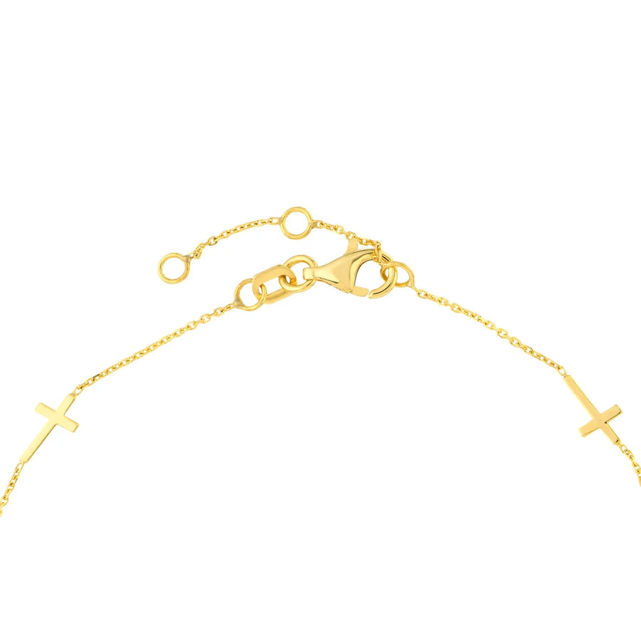 sideways cross bracelet gold