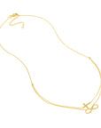 gold cross necklace with infinity symbol