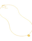 gold necklace with small circle pendant